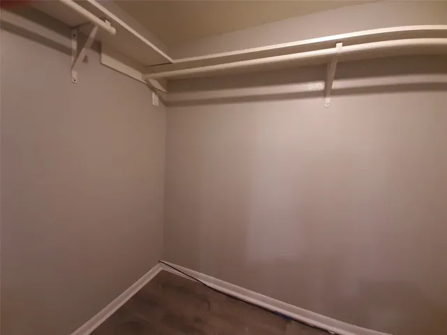 a view of a room with racks on the wall