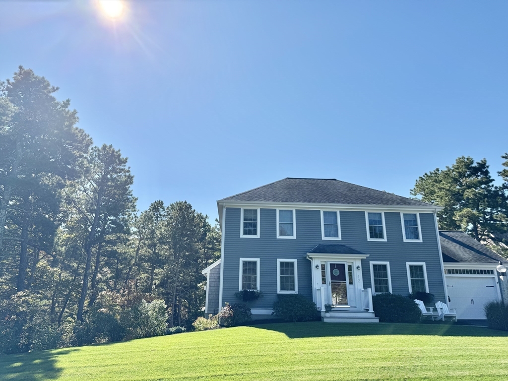 12 Wintergreen Road Mashpee, MA 02649 - Photo 11 of 40 a front view of a house with a yard
