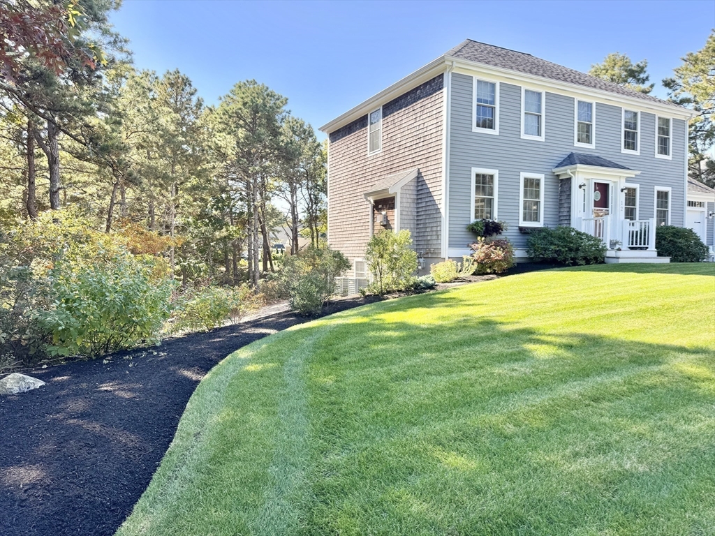 12 Wintergreen Road Mashpee, MA 02649 - Photo 12 of 40 a view of a house with a yard