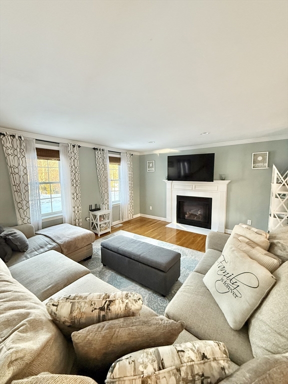 12 Wintergreen Road Mashpee, MA 02649 - Photo 14 of 40 a living room with furniture and a fireplace