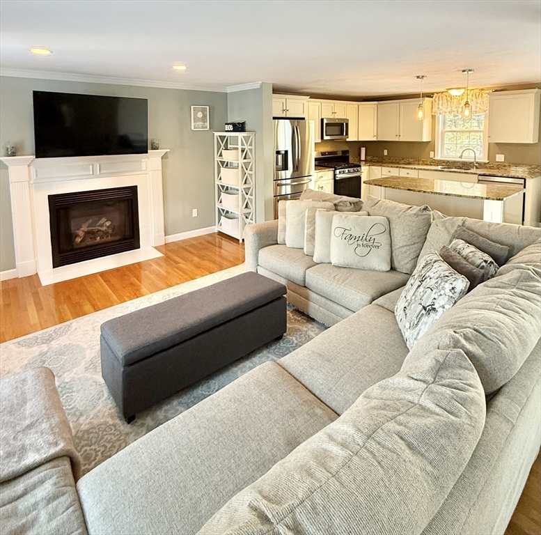 12 Wintergreen Road Mashpee, MA 02649 - Photo 15 of 40 a living room with furniture fireplace and flat screen tv
