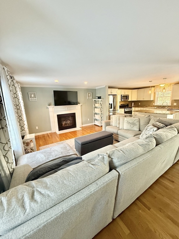 12 Wintergreen Road Mashpee, MA 02649 - Photo 17 of 40 a living room with furniture and a flat screen tv