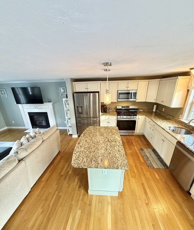 12 Wintergreen Road Mashpee, MA 02649 - Photo 18 of 40 a large bedroom with a bed and flat screen tv