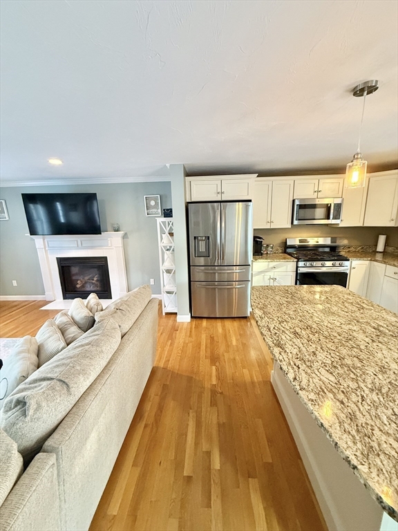 12 Wintergreen Road Mashpee, MA 02649 - Photo 19 of 40 a bed room with a bed and a television