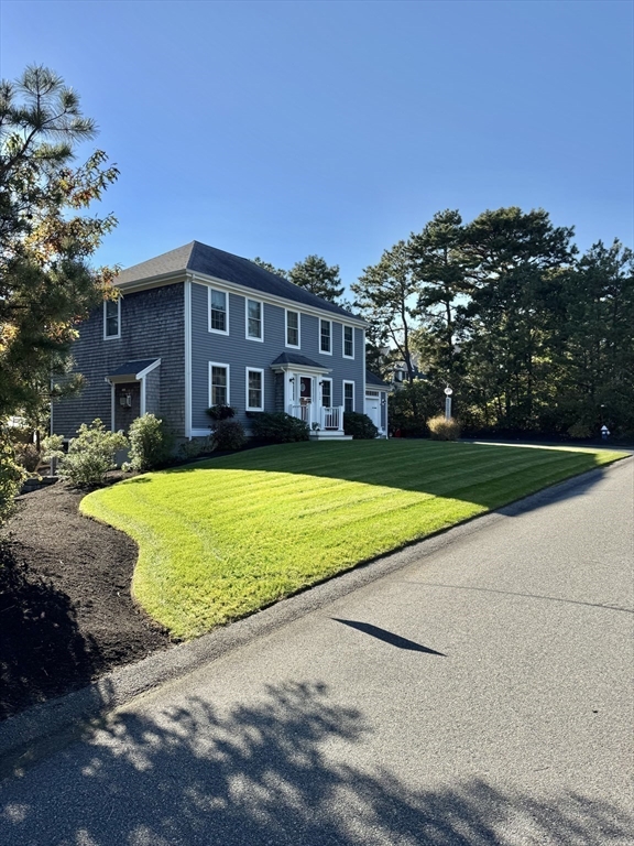 12 Wintergreen Road Mashpee, MA 02649 - Photo 2 of 40 a view of outdoor space yard swimming pool and patio