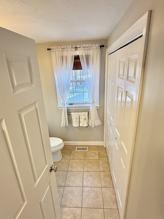 12 Wintergreen Road Mashpee, MA 02649 - Photo 29 of 40 a bathroom with a toilet and a shower
