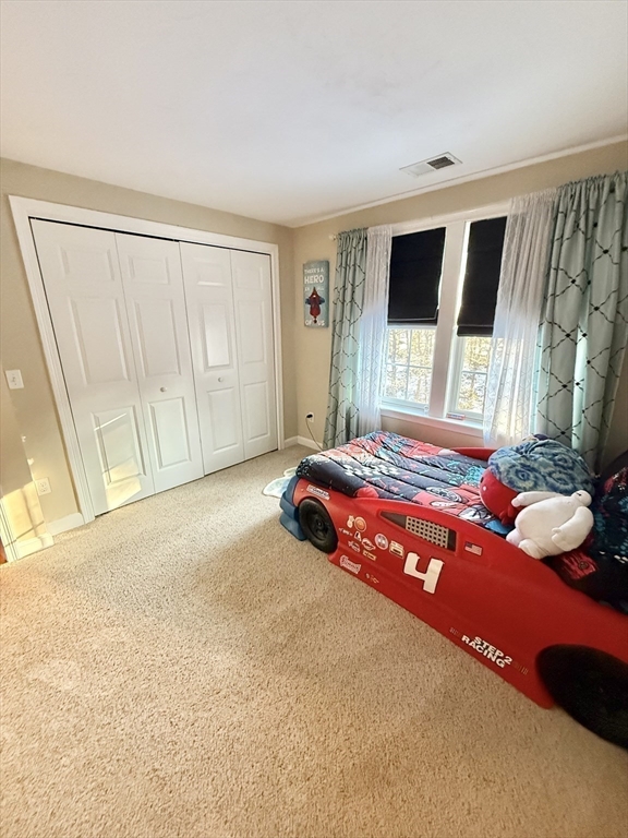 12 Wintergreen Road Mashpee, MA 02649 - Photo 31 of 40 a bedroom with a bed and window