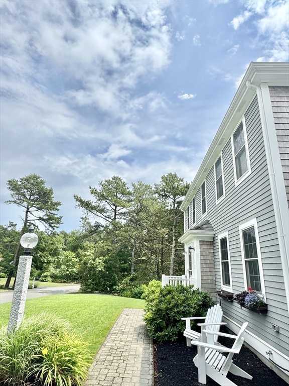12 Wintergreen Road Mashpee, MA 02649 - Photo 9 of 40 a house view with a garden space