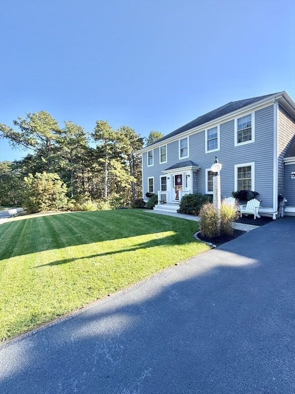12 Wintergreen Road Mashpee, MA 02649 - Photo 10 of 40 a view of an house with backyard outdoor space and swimming pool