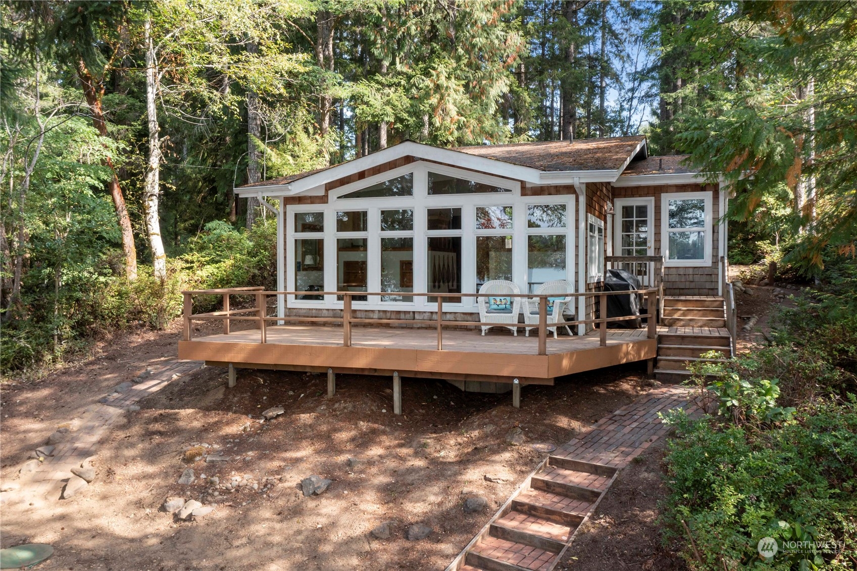 a backyard of a house with swimming pool and porch