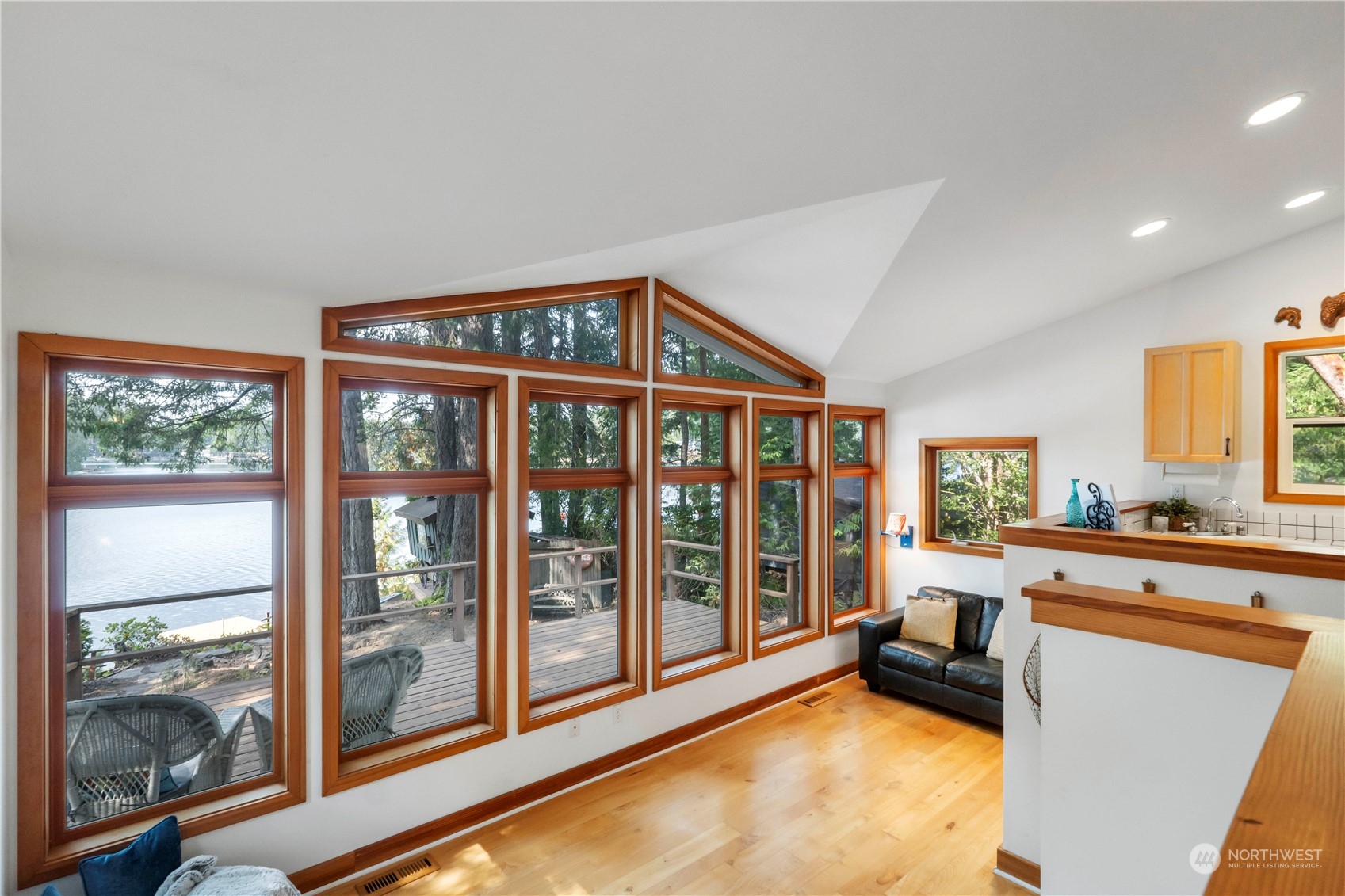 720 East Phillips Lake Loop Road Shelton, WA 98584 - Photo 12 of 31 a spacious bedroom with a large window and furniture