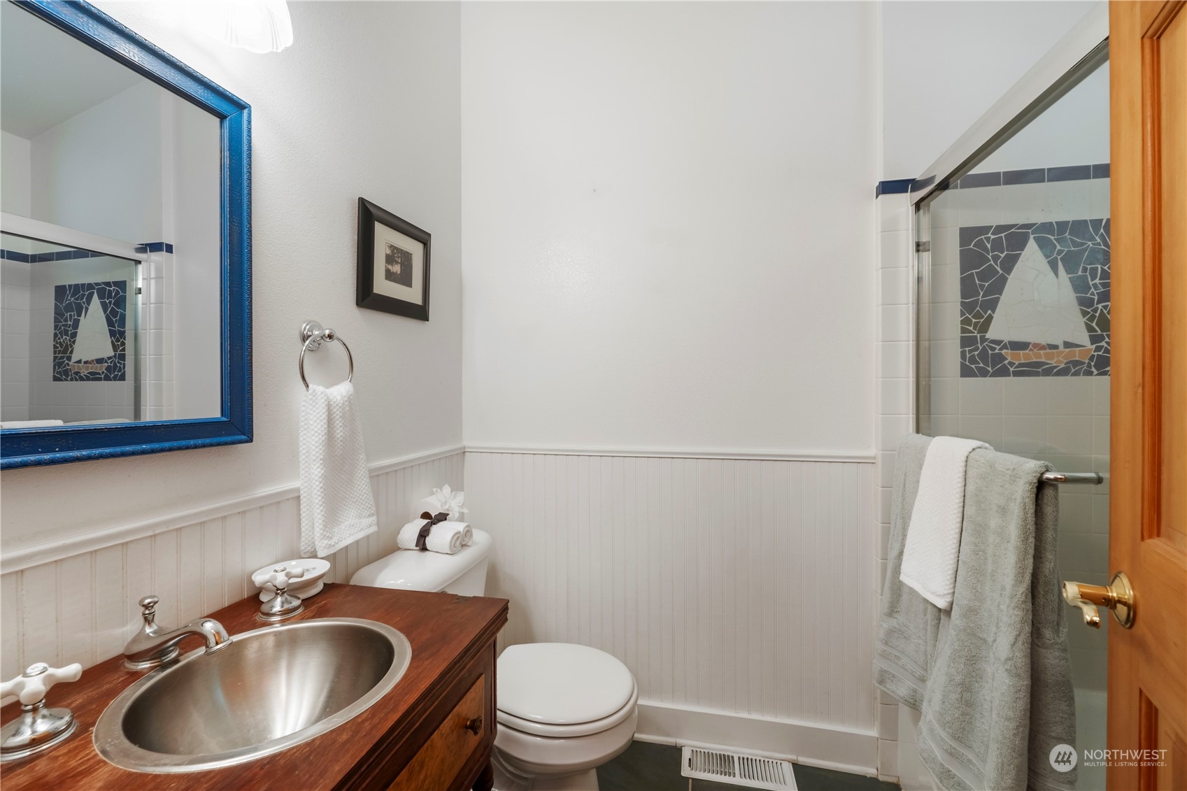 720 East Phillips Lake Loop Road Shelton, WA 98584 - Photo 20 of 31 a bathroom with a sink a toilet and a mirror