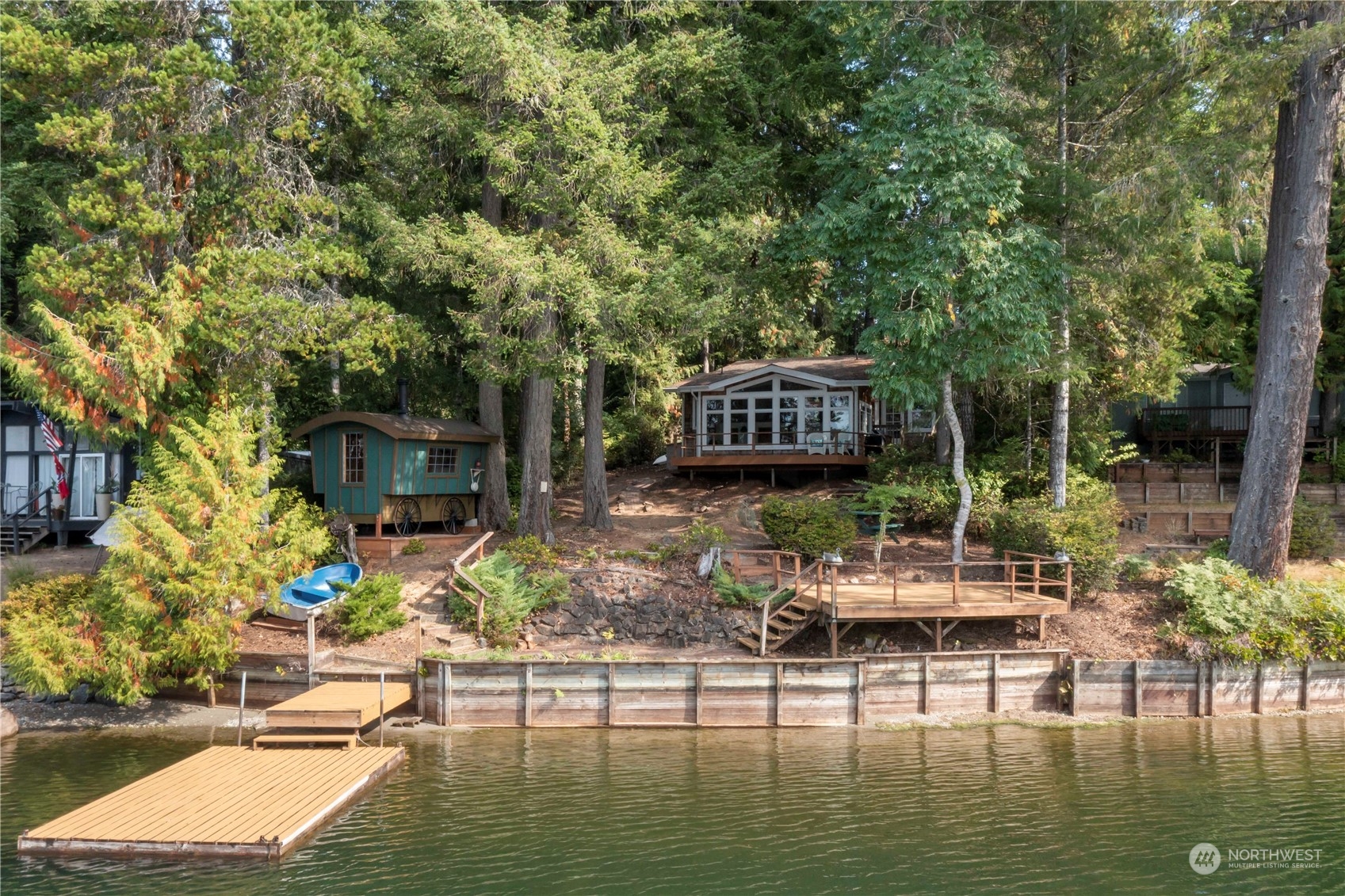 720 East Phillips Lake Loop Road Shelton, WA 98584 - Photo 2 of 31 a view of house with swimming pool and outdoor seating