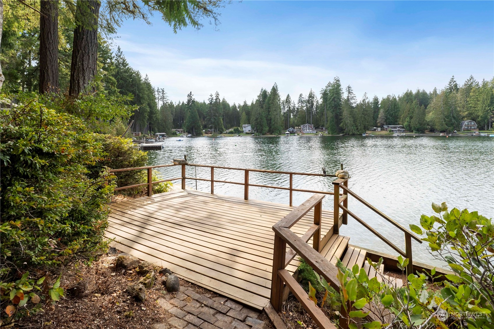 720 East Phillips Lake Loop Road Shelton, WA 98584 - Photo 23 of 31 a view of a lake with a deck