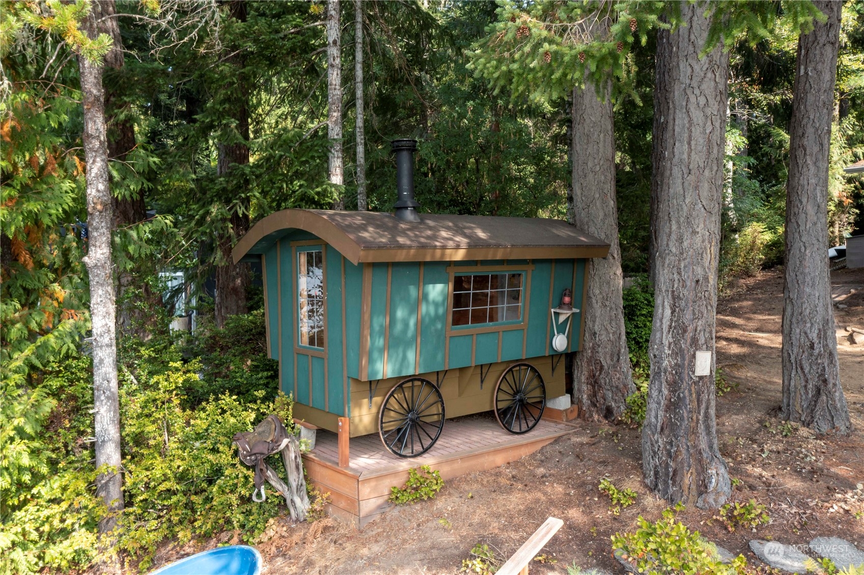 720 East Phillips Lake Loop Road Shelton, WA 98584 - Photo 25 of 31 a view of a small house with yard and sitting area