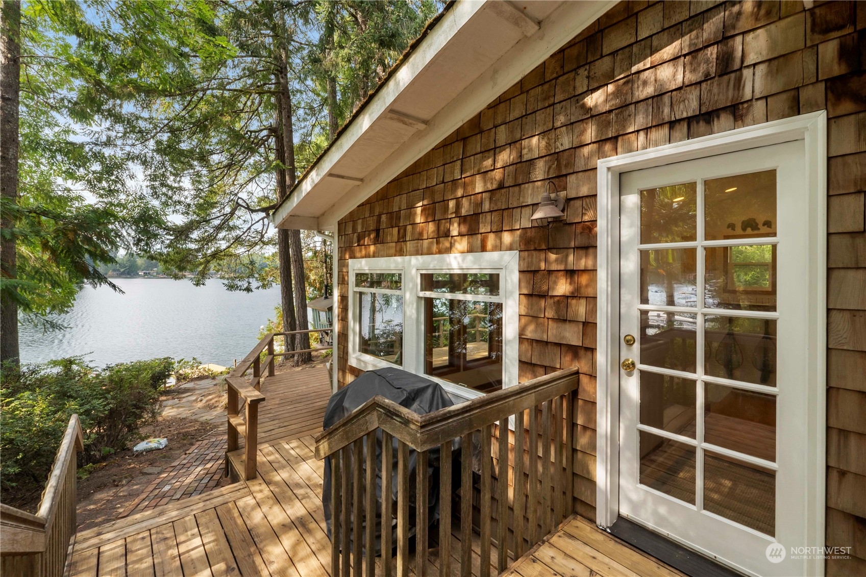 720 East Phillips Lake Loop Road Shelton, WA 98584 - Photo 28 of 31 a view of a balcony with chairs and wooden fence