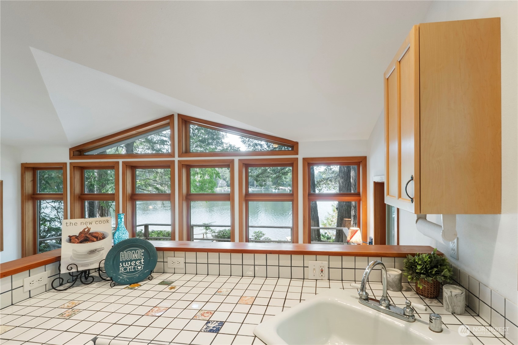 720 East Phillips Lake Loop Road Shelton, WA 98584 - Photo 7 of 31 a bedroom with a bed and glass windows