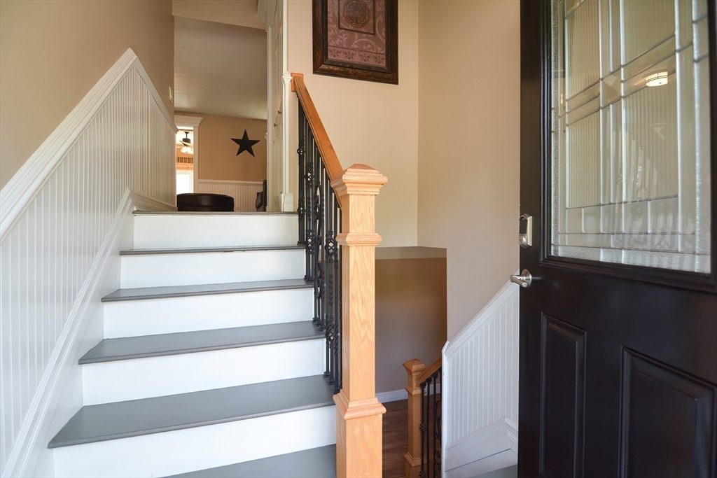 7 Northgate Road Franklin, MA 02038 - Photo 11 of 42 a view of staircase with white walls and a window