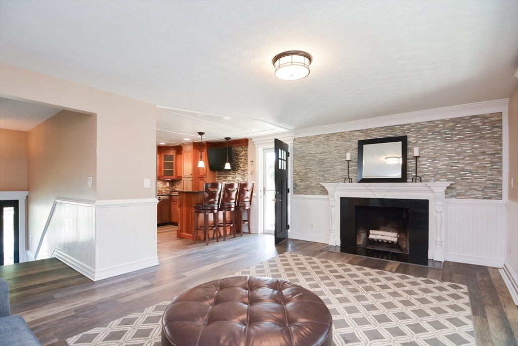 7 Northgate Road Franklin, MA 02038 - Photo 12 of 42 a living room with furniture and a fireplace