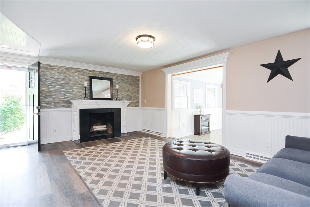 7 Northgate Road Franklin, MA 02038 - Photo 13 of 42 a living room with furniture and a fireplace
