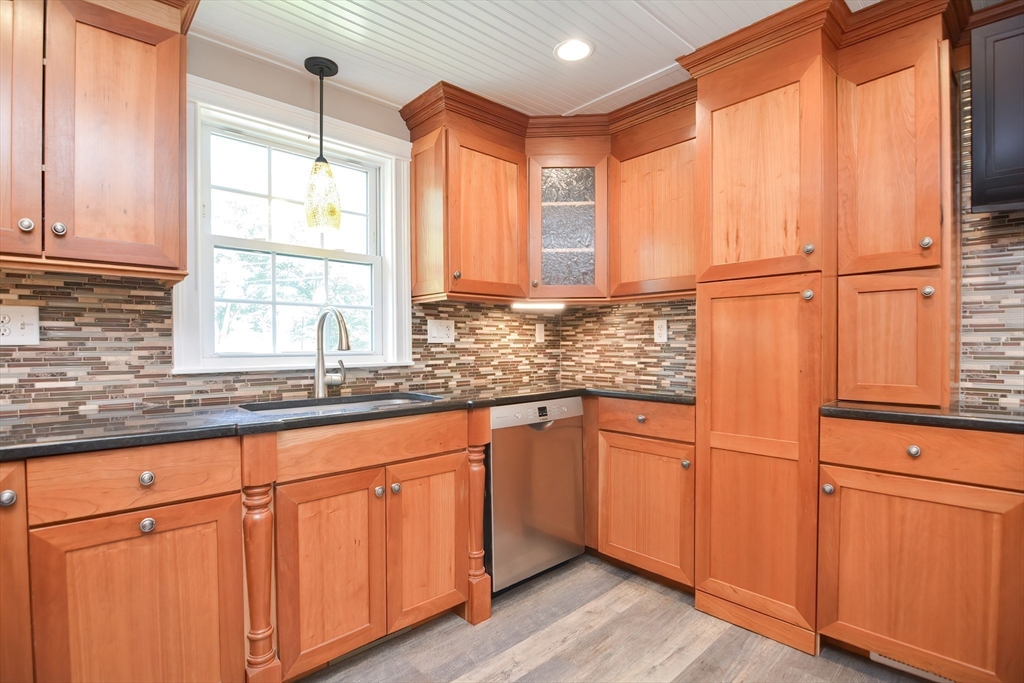 7 Northgate Road Franklin, MA 02038 - Photo 16 of 42 a kitchen with stainless steel appliances granite countertop cabinets and a large window