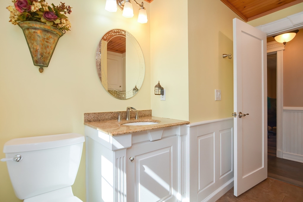 7 Northgate Road Franklin, MA 02038 - Photo 23 of 42 a bathroom with a sink and mirror with toilet