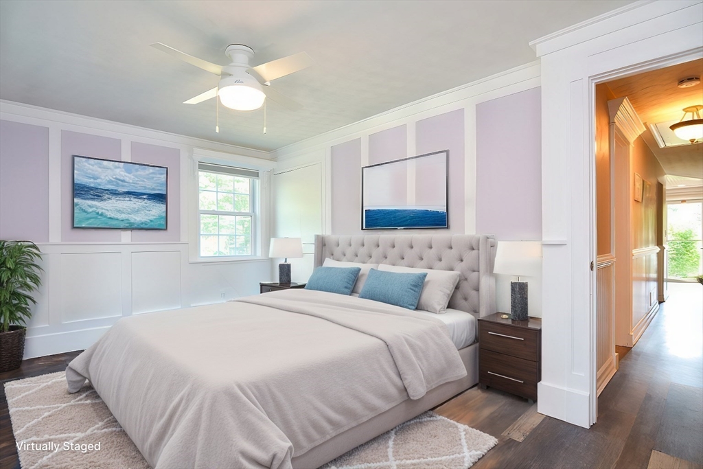 7 Northgate Road Franklin, MA 02038 - Photo 26 of 42 a bedroom with a large bed and a chandelier