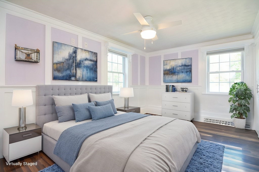 7 Northgate Road Franklin, MA 02038 - Photo 27 of 42 a bedroom with a large bed and a chandelier