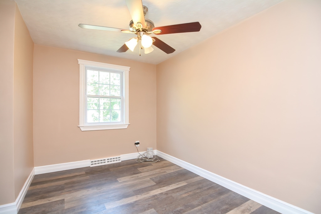 7 Northgate Road Franklin, MA 02038 - Photo 29 of 42 an empty room with wooden floor and windows