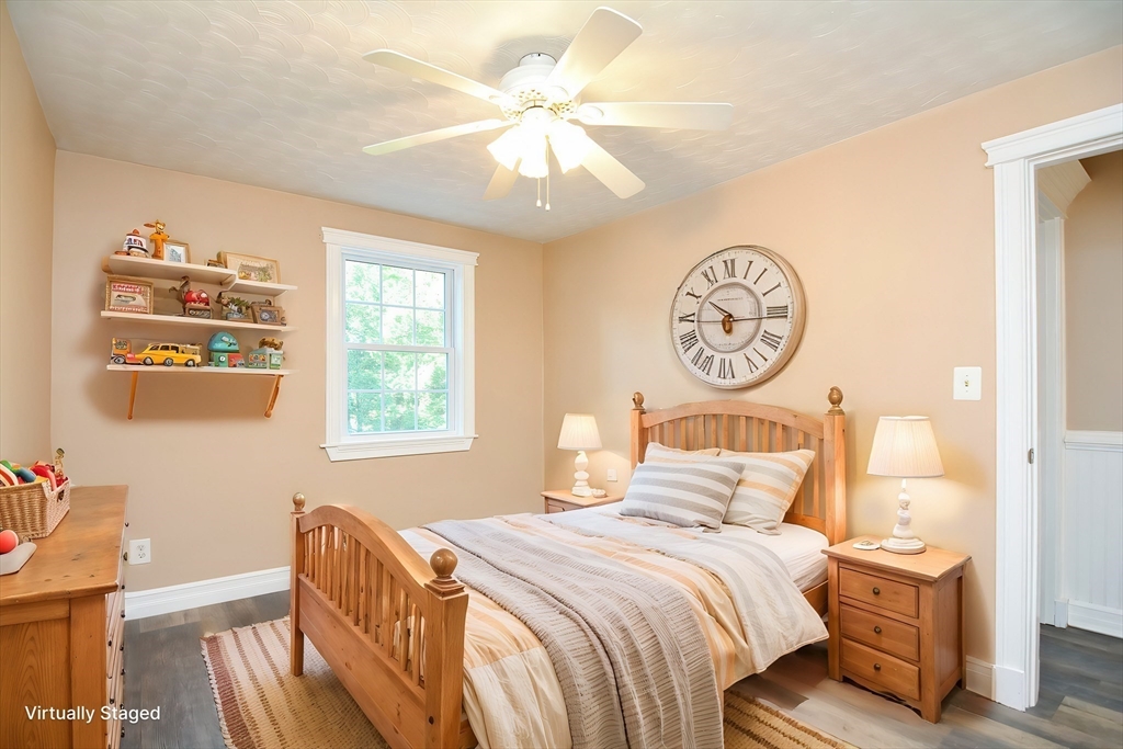 7 Northgate Road Franklin, MA 02038 - Photo 30 of 42 a bedroom with a bed and a chandelier