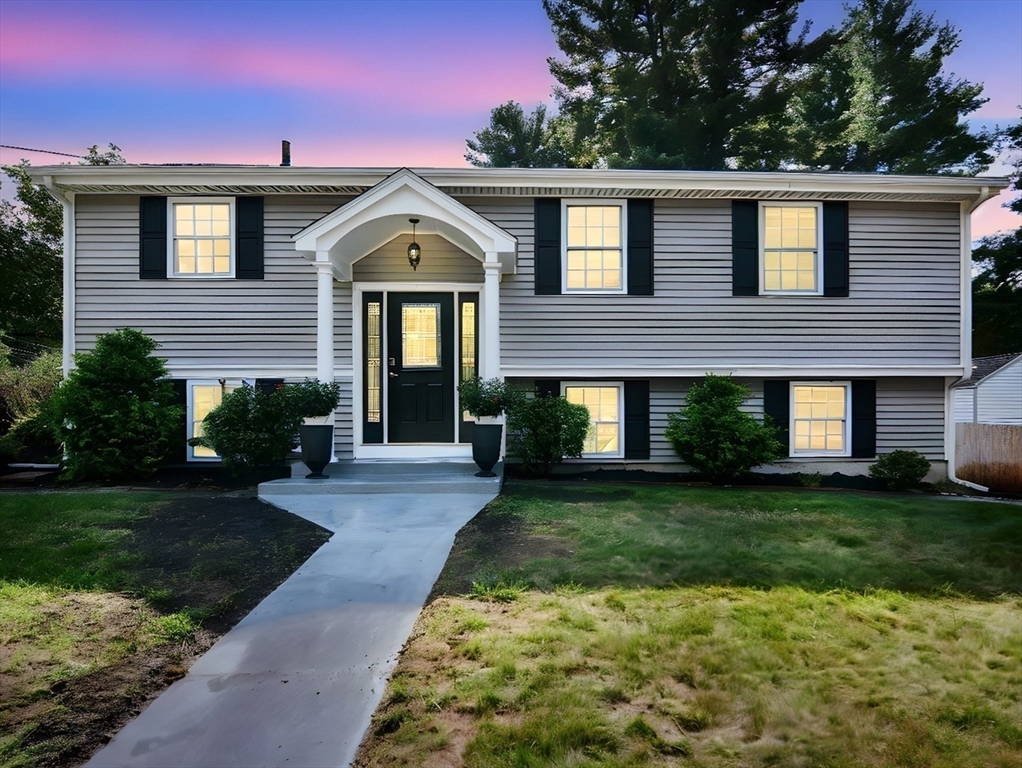 7 Northgate Road Franklin, MA 02038 - Photo 4 of 42 a front view of a house with garden