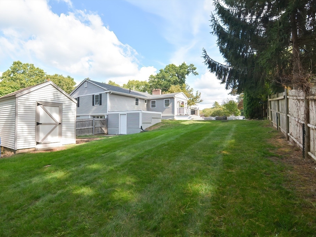7 Northgate Road Franklin, MA 02038 - Photo 7 of 42 a view of a house with a big yard and large trees