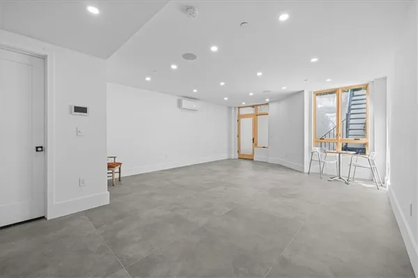 a view of an empty room with glass door