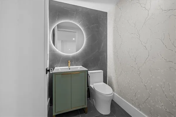 a bathroom with a toilet and a sink