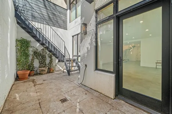 a view of a porch with wooden floor and stairs