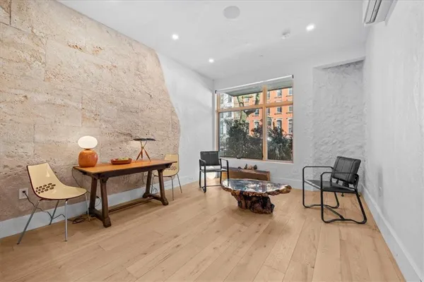 a living room with furniture and a window
