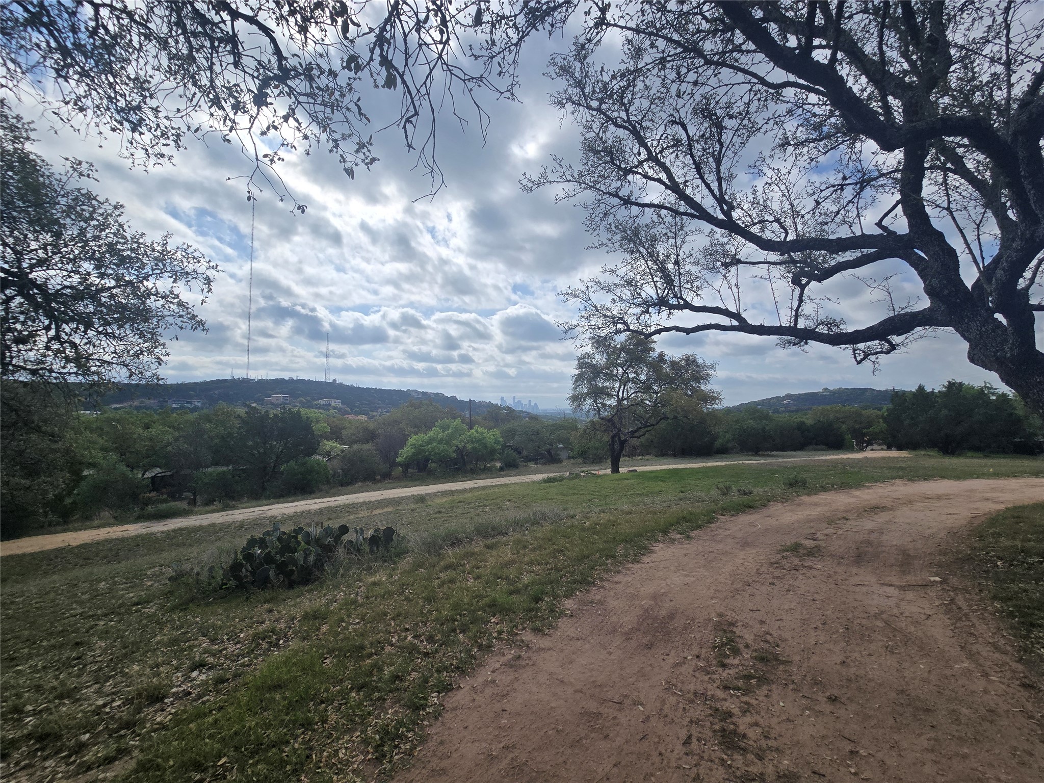 1106 The High Road, Unit A Austin, TX 78746 - Photo 11 of 12 View of mountain backdrop featuring rural landscape