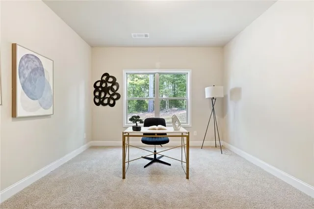 a workspace with furniture and a window