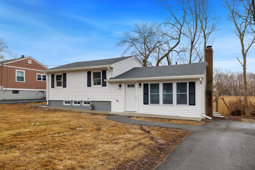 83 Riverbank Road Saugus, MA 01906 - Photo 1 of 36 front view of a house with a yard