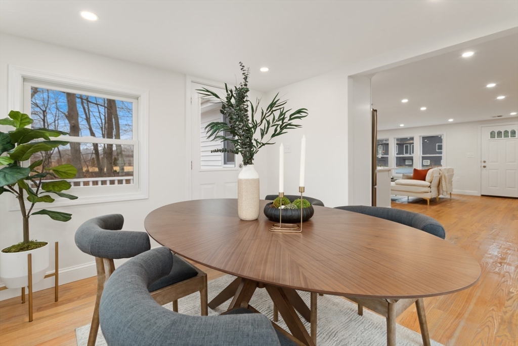 83 Riverbank Road Saugus, MA 01906 - Photo 20 of 36 a view of a dining room with furniture and wooden floor