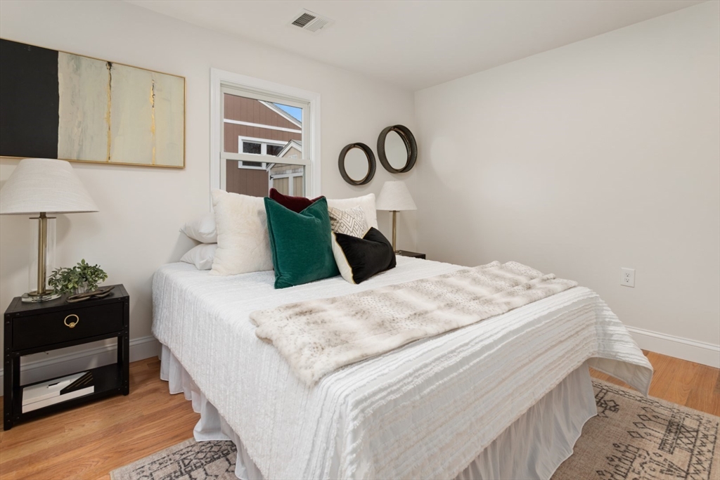 83 Riverbank Road Saugus, MA 01906 - Photo 23 of 36 a bedroom with a bed and window