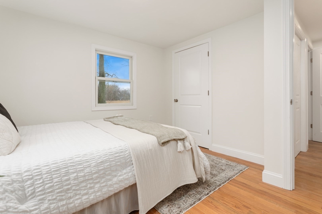 83 Riverbank Road Saugus, MA 01906 - Photo 26 of 36 a bedroom with a bed and a window