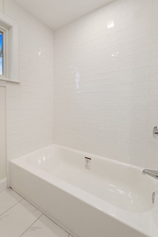 83 Riverbank Road Saugus, MA 01906 - Photo 29 of 36 a bathroom with a bathtub