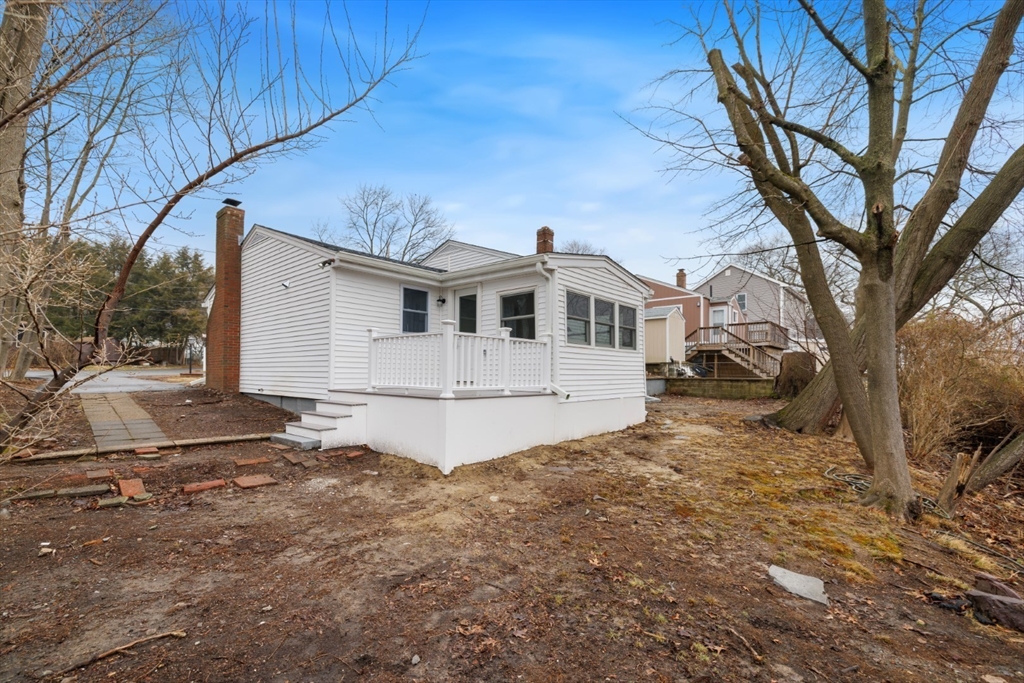 83 Riverbank Road Saugus, MA 01906 - Photo 33 of 36 a view of a house with a yard