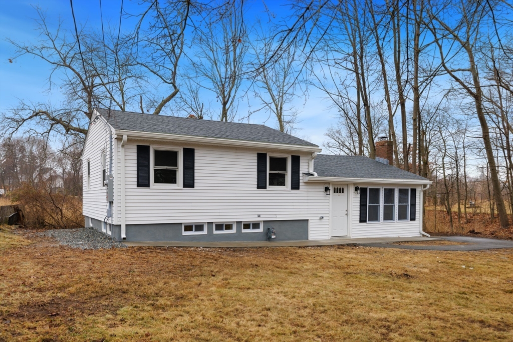 83 Riverbank Road Saugus, MA 01906 - Photo 36 of 36 a view of a white house with a yard