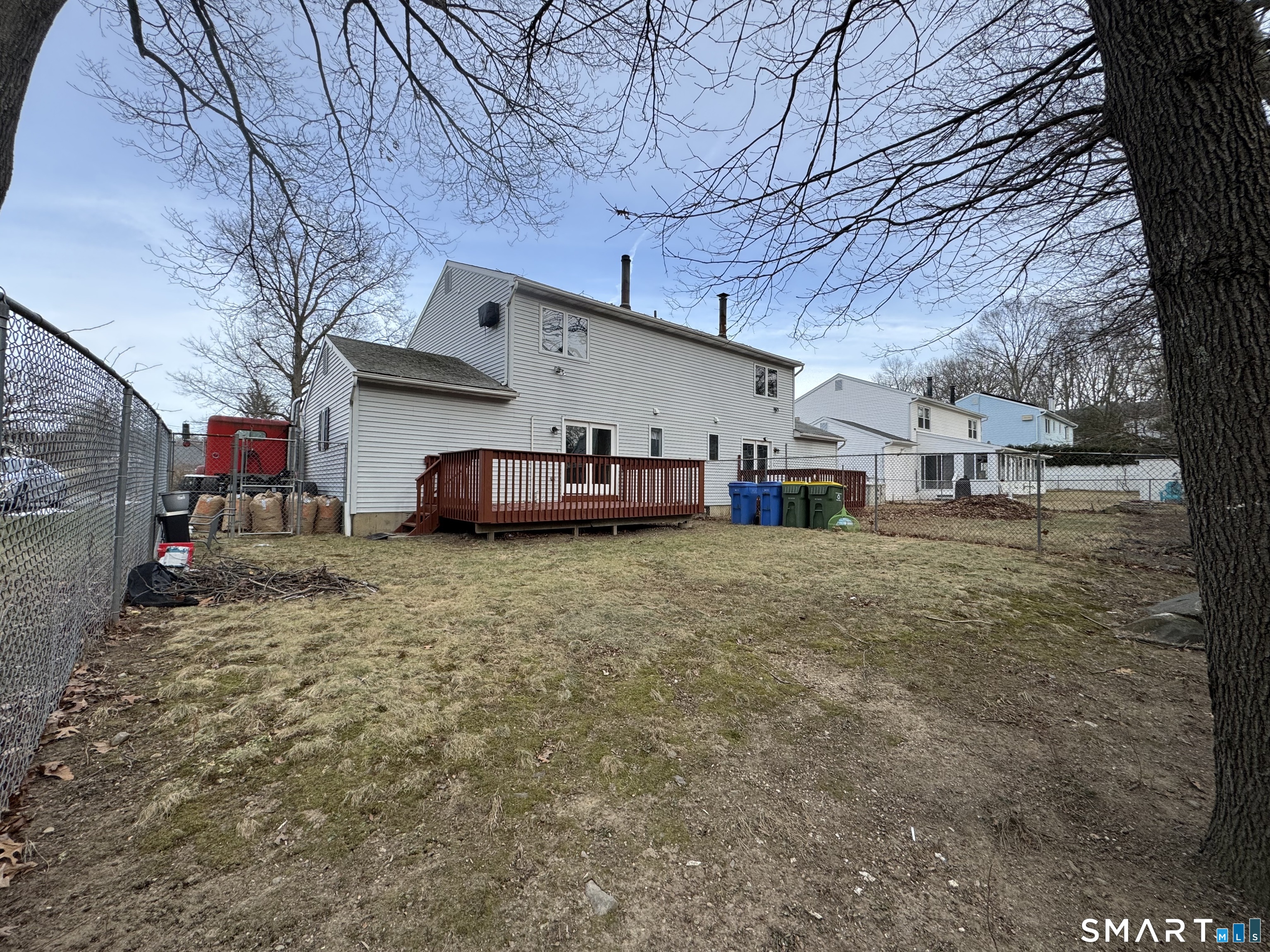 27 Katie Lane Waterbury, CT 06708 - Photo 14 of 14 a backyard of a house with oven and large tree