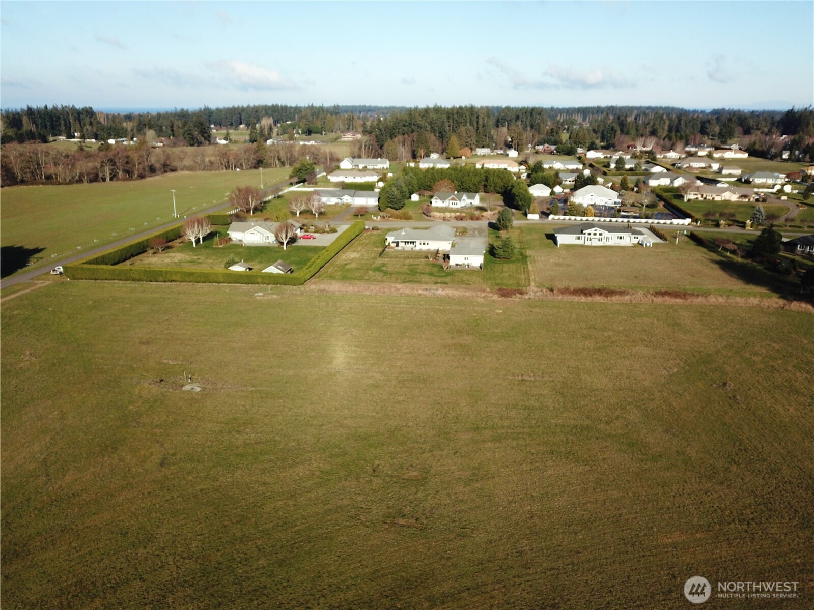 9999 Wheeler Road Sequim, WA 98382 - Photo 7 of 11 an aerial view of a city with ocean view