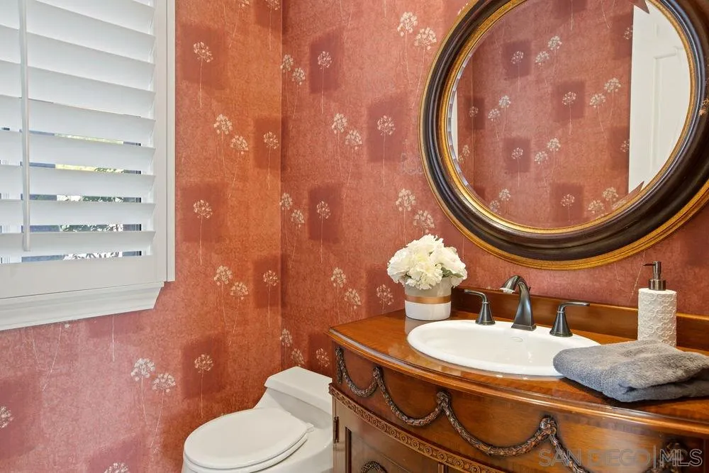 14331 Twisted Branch Road Poway, CA 92064 - Photo 11 of 25 a bathroom with a toilet sink and mirror