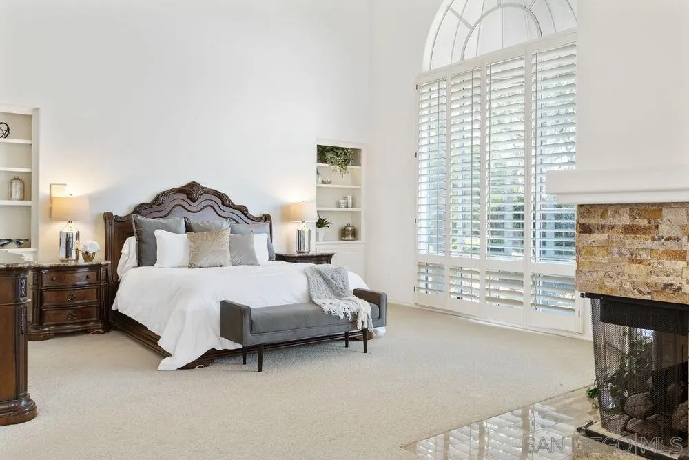 14331 Twisted Branch Road Poway, CA 92064 - Photo 13 of 25 a spacious bedroom with a bed and a couch