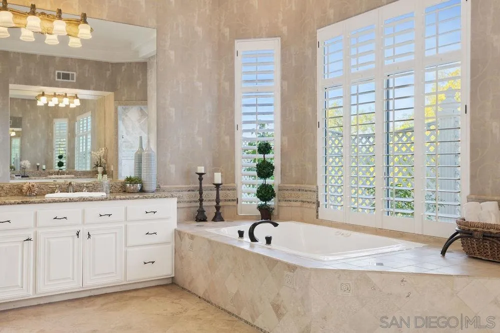 14331 Twisted Branch Road Poway, CA 92064 - Photo 14 of 25 a spacious bathroom with tub sink and mirror